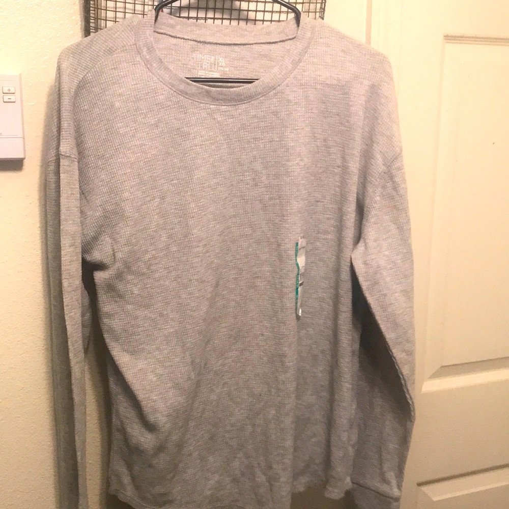A long sleeved shirt. The size is an XL (16-18). Is from the brand Time And Tru.